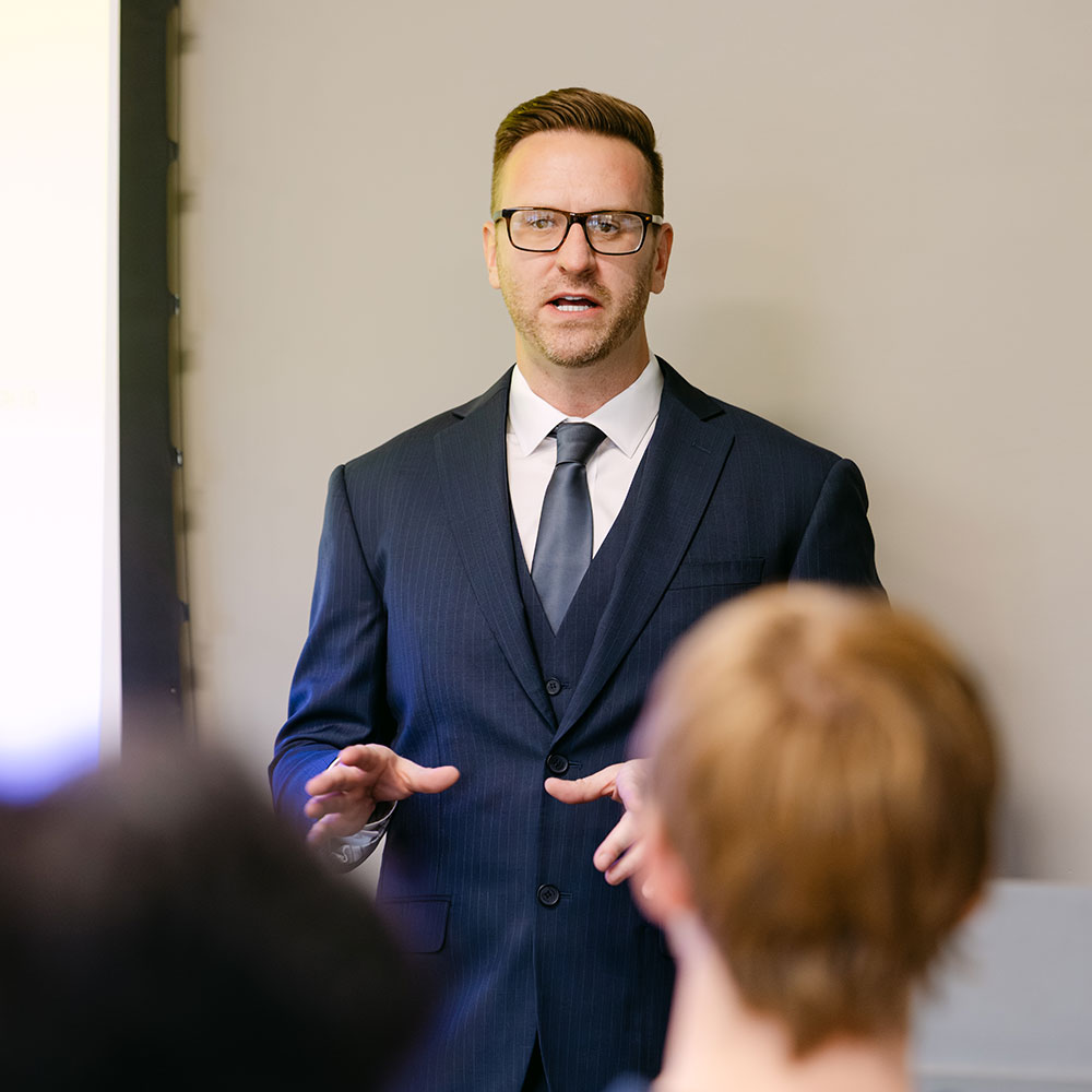 Dr. Kyle J. Harkema teaching a strategic business course